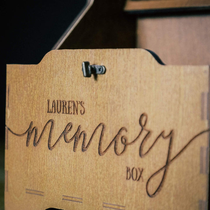 Close-up of engraved text on memory box