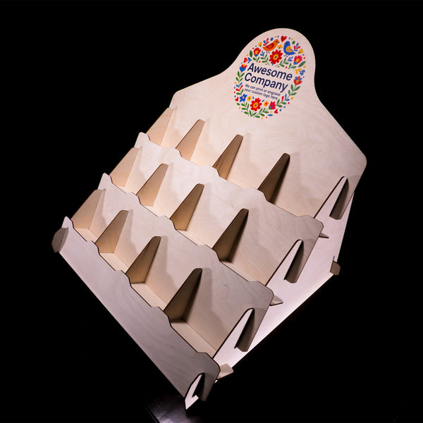 Three-quarter front view of countertop coaster display with twelve square pockets