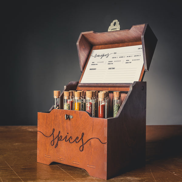 Custom wooden spice box with test tubes on kitchen counter