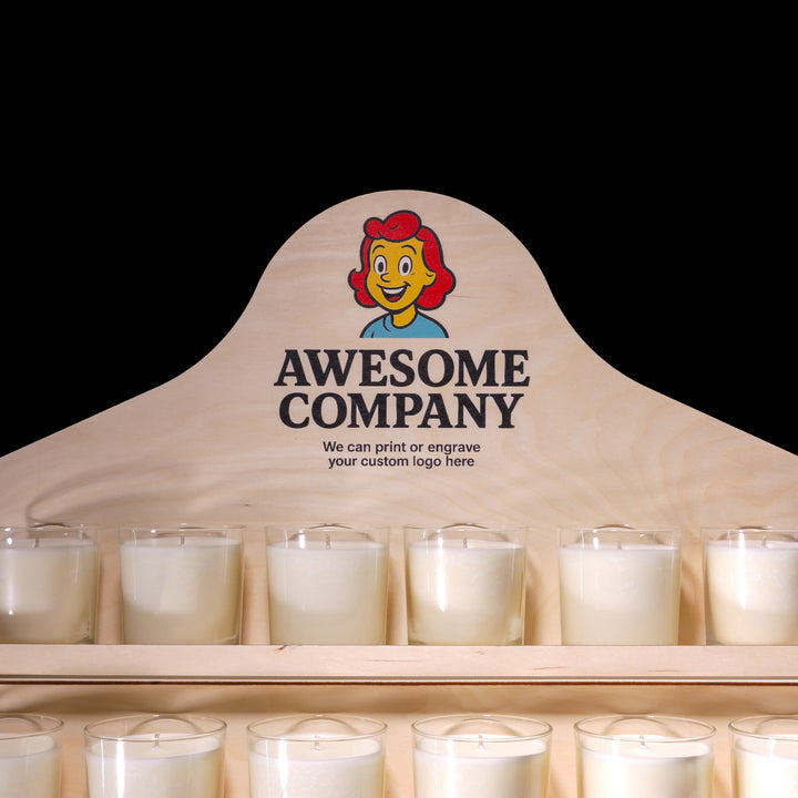 Display of candles with a wooden sign featuring 'Awesome Company' and a logo.