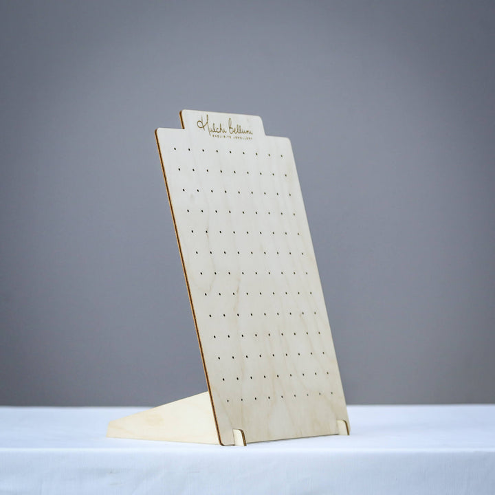 Portable earring display stand on table