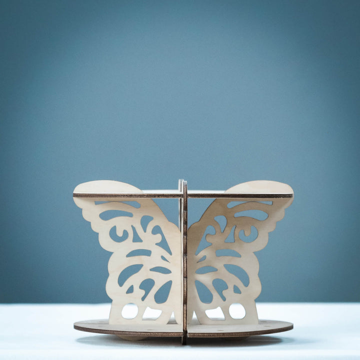 Wooden cake pop stand with decorative butterfly wings